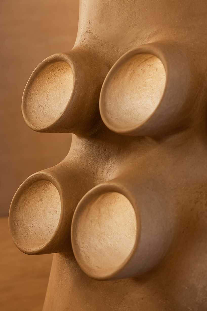 giant sewing machine sculpture takes center stage in dage curtain store by molos