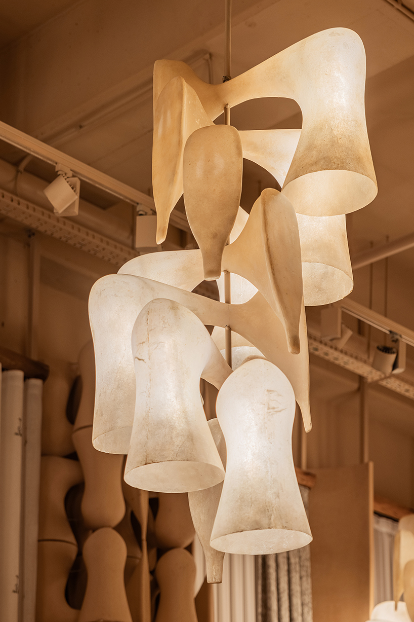 giant sewing machine sculpture takes center stage in dage curtain store by molos