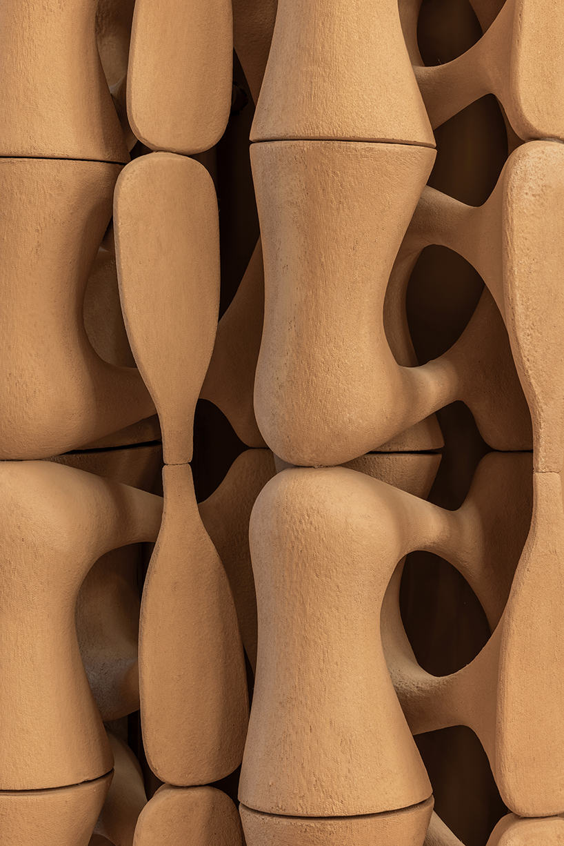 giant sewing machine sculpture takes center stage in dage curtain store by molos