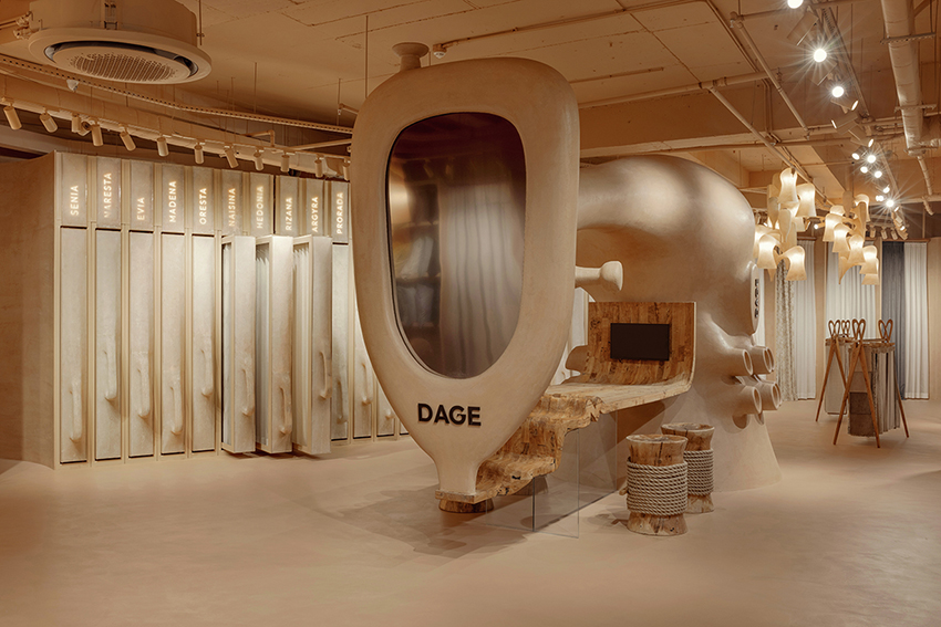 giant sewing machine sculpture takes center stage in dage curtain store by molos