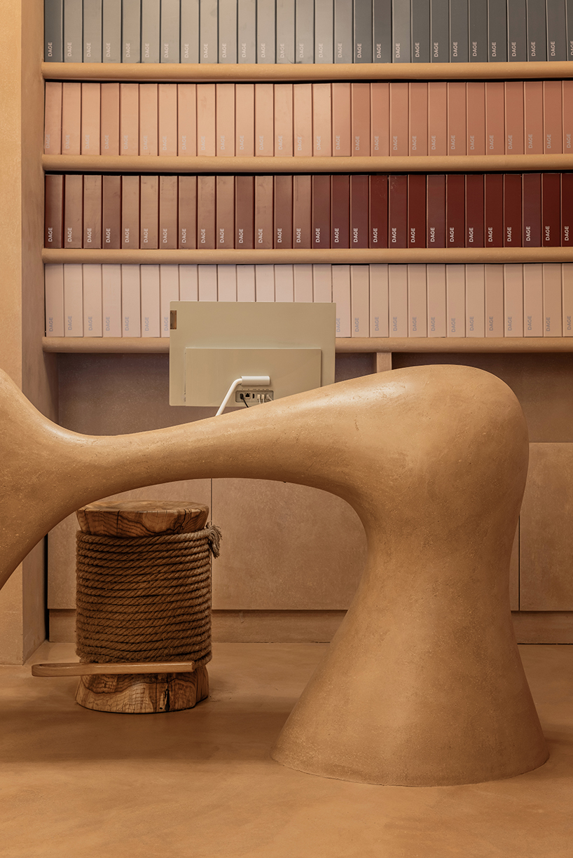 giant sewing machine sculpture takes center stage in dage curtain store by molos