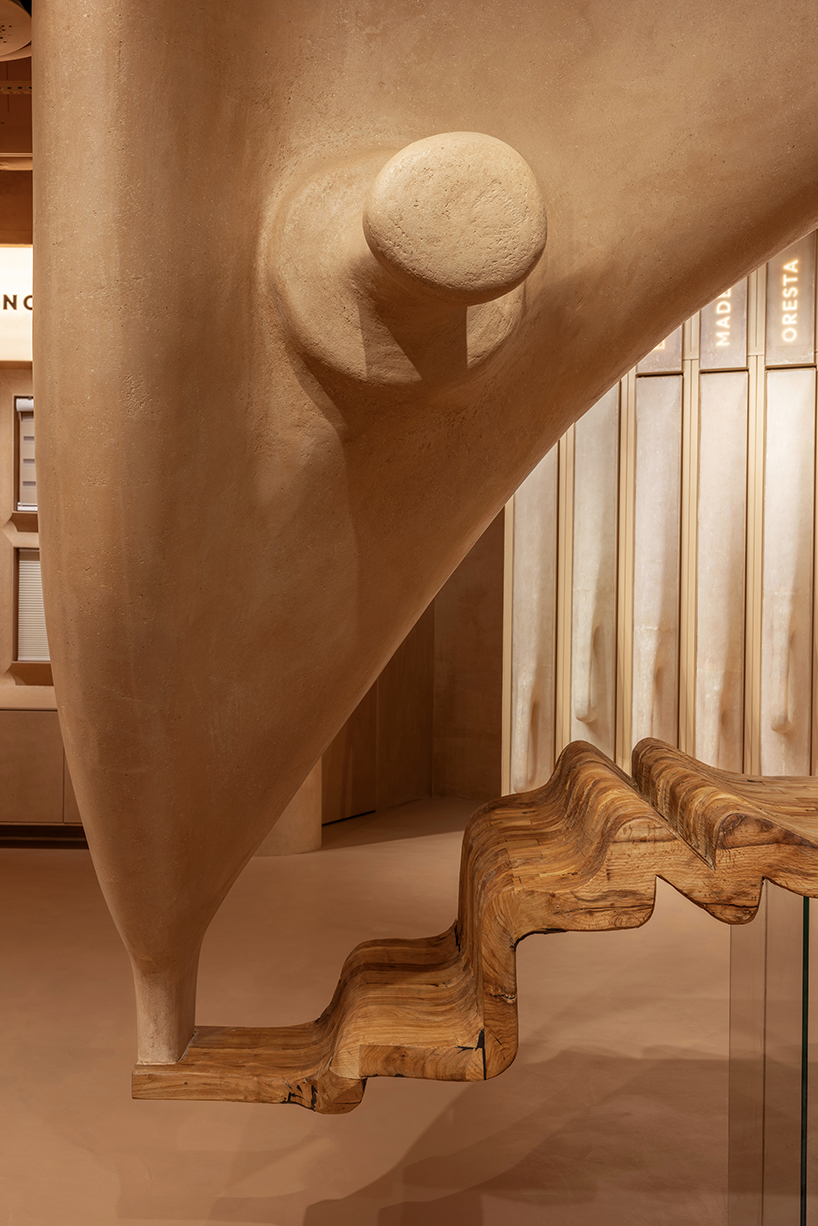giant sewing machine sculpture takes center stage in dage curtain store by molos