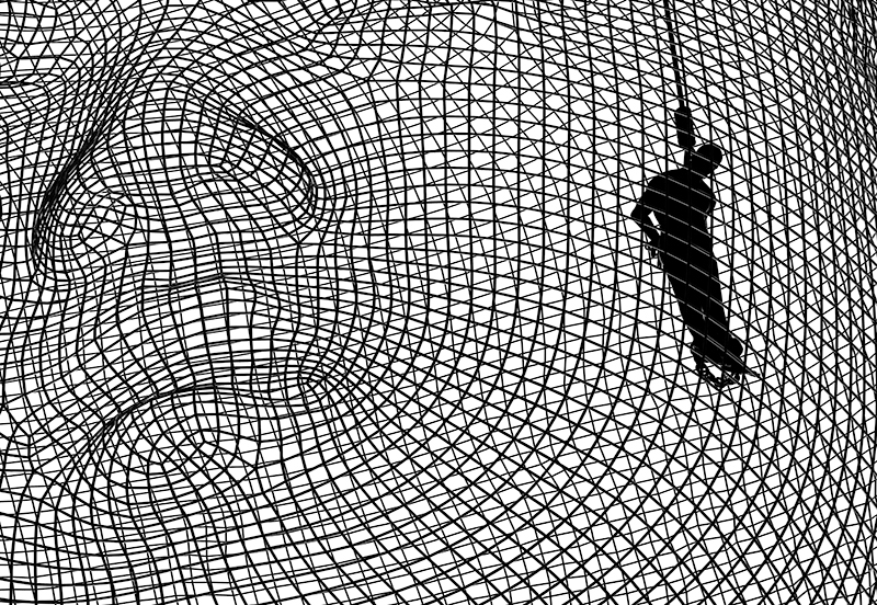 prison-like illustrations of dictators' heads address lack of human rights