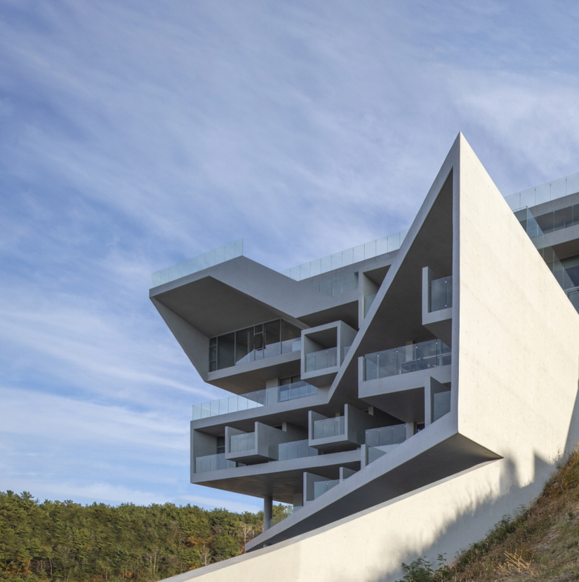 IDMM architects stacks angular concrete volumes to compose immersive hotel in korea
