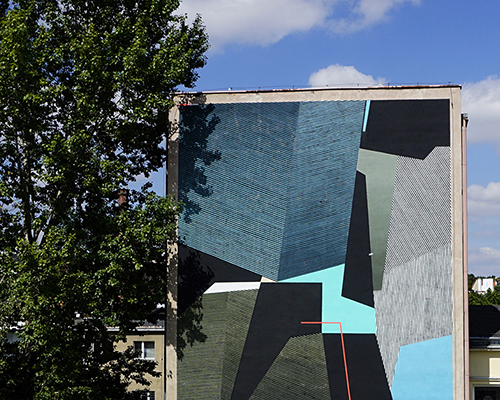 seikon creates vibrant mural painting on old balneotherapy center in świdnica, poland