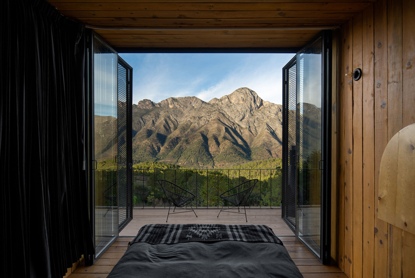 wooden shell wraps eco cabins by S-AR framing mexican valley views