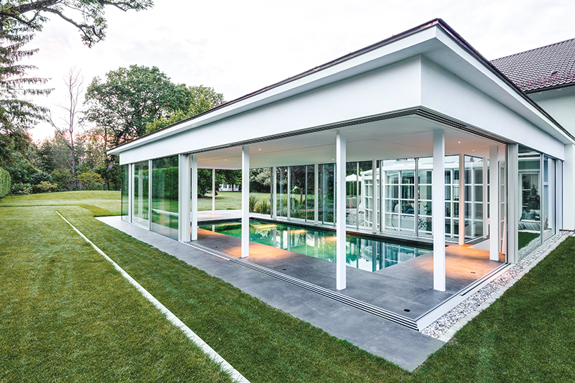 MEER architekten embeds private poolhouse as a glazed pavilion in ismaning, munich