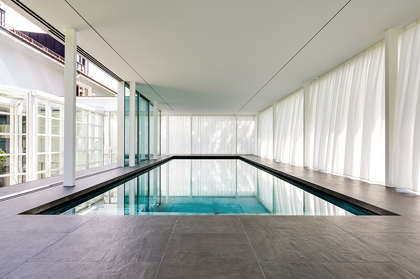 MEER architekten embeds private poolhouse as a glazed pavilion in ismaning, munich