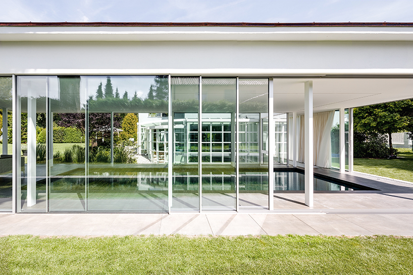 MEER architekten embeds private poolhouse as a glazed pavilion in ismaning, munich