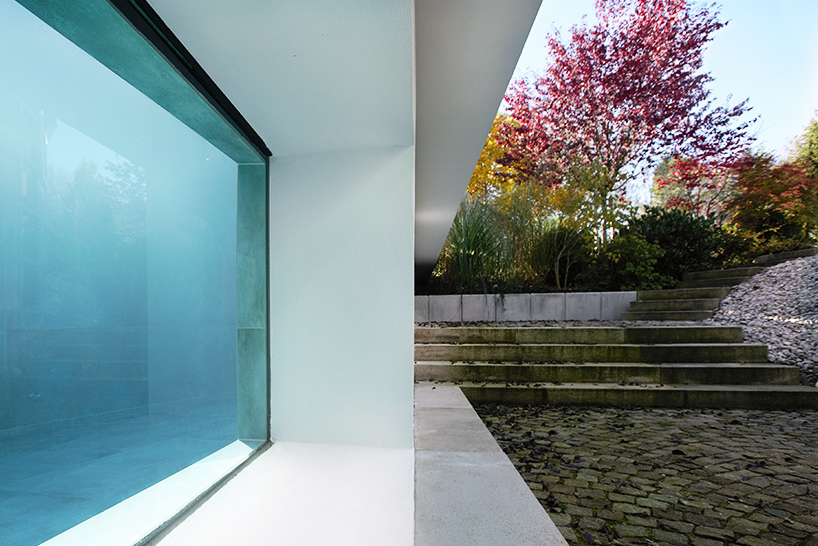 MEER architekten embeds private poolhouse as a glazed pavilion in ismaning, munich
