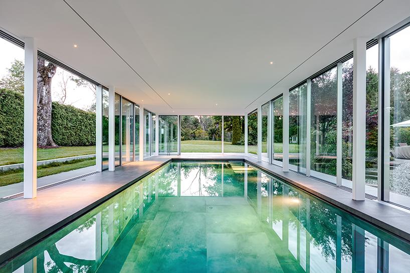 MEER architekten embeds private poolhouse as a glazed pavilion in ismaning, munich