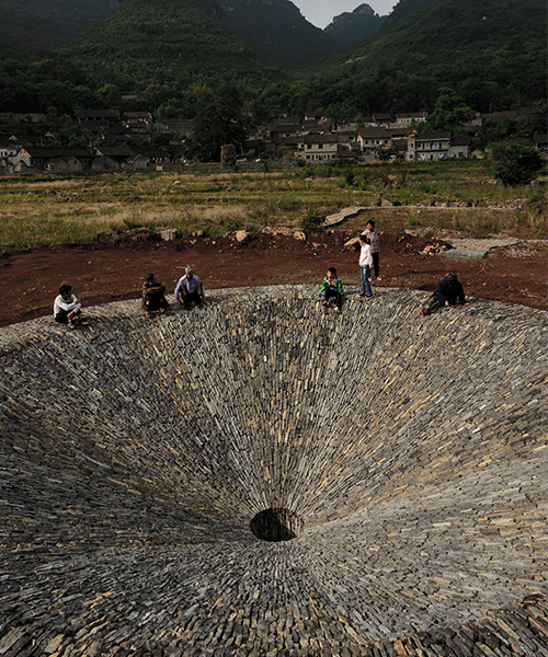 V studio creates giant stone sinkhole to commemorate a village's disappearing rain cycle