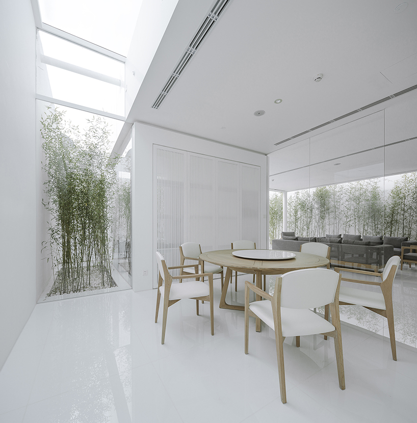 v studio's rooftop bamboo garden sits atop a busy chinese shopping mall