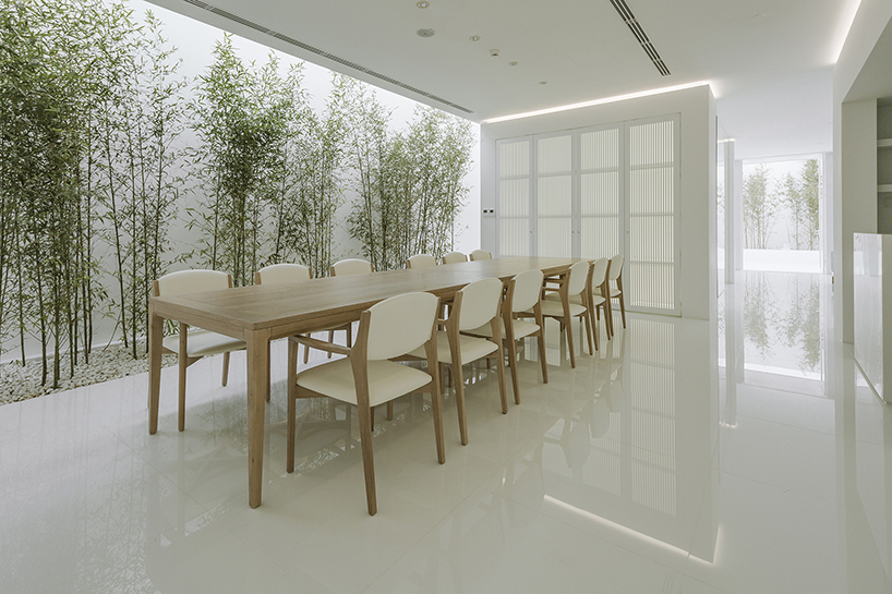 v studio's rooftop bamboo garden sits atop a busy chinese shopping mall