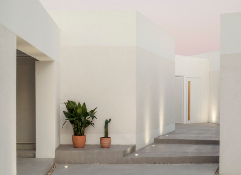 nomo studio lifts white polyhedral volumes above spanish landscape