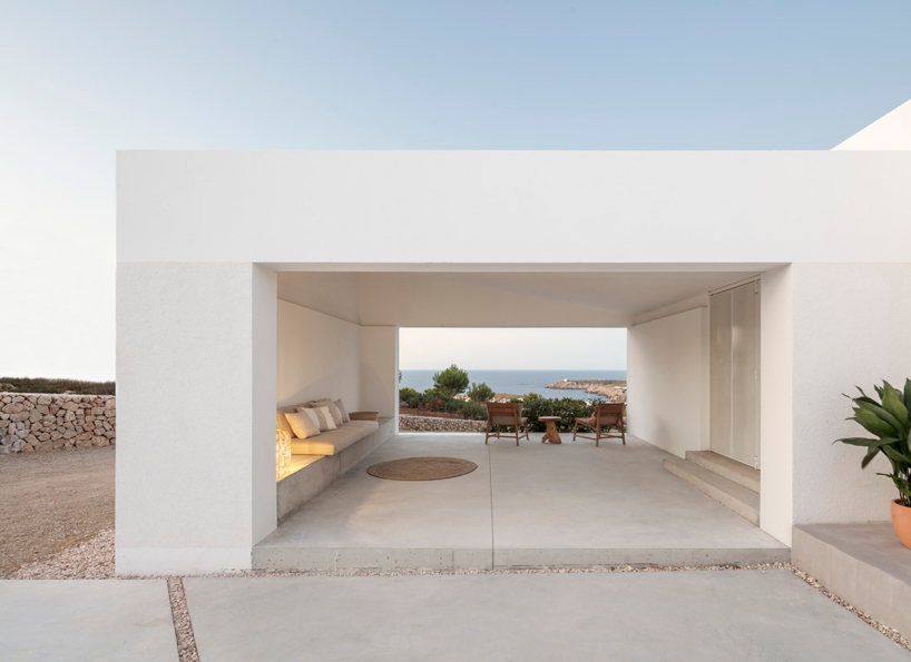 nomo studio lifts white polyhedral volumes above spanish landscape