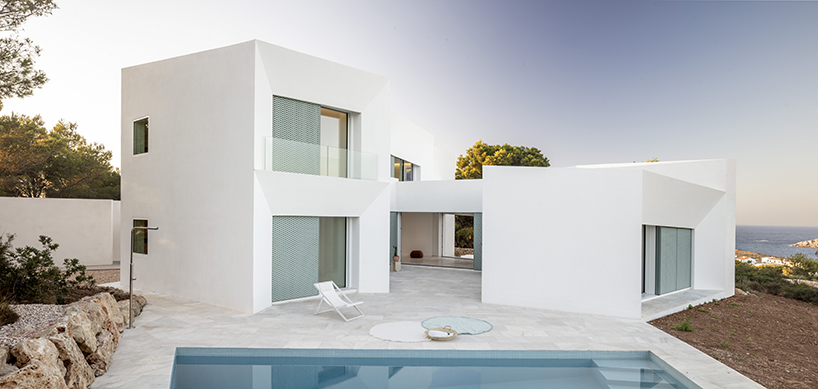 'patio house' by nomo studio offers unobstructed sea views in menorca, spain
