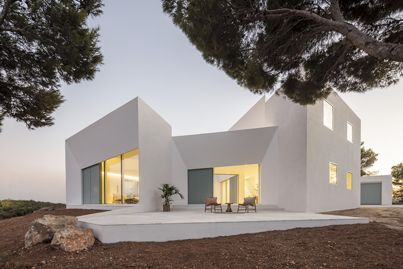 'patio house' by nomo studio offers unobstructed sea views in menorca, spain