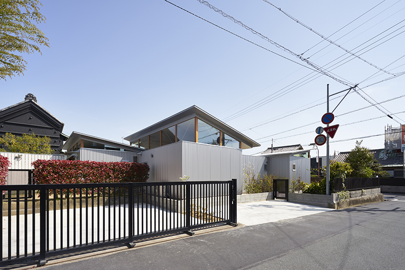 ARII IRIE architects crowns japanese house with elevated roofs in hamamatsu
