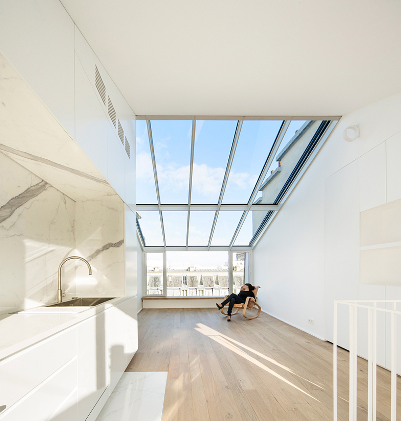 vincent parreira converts 19th century photography studio into parisian apartments