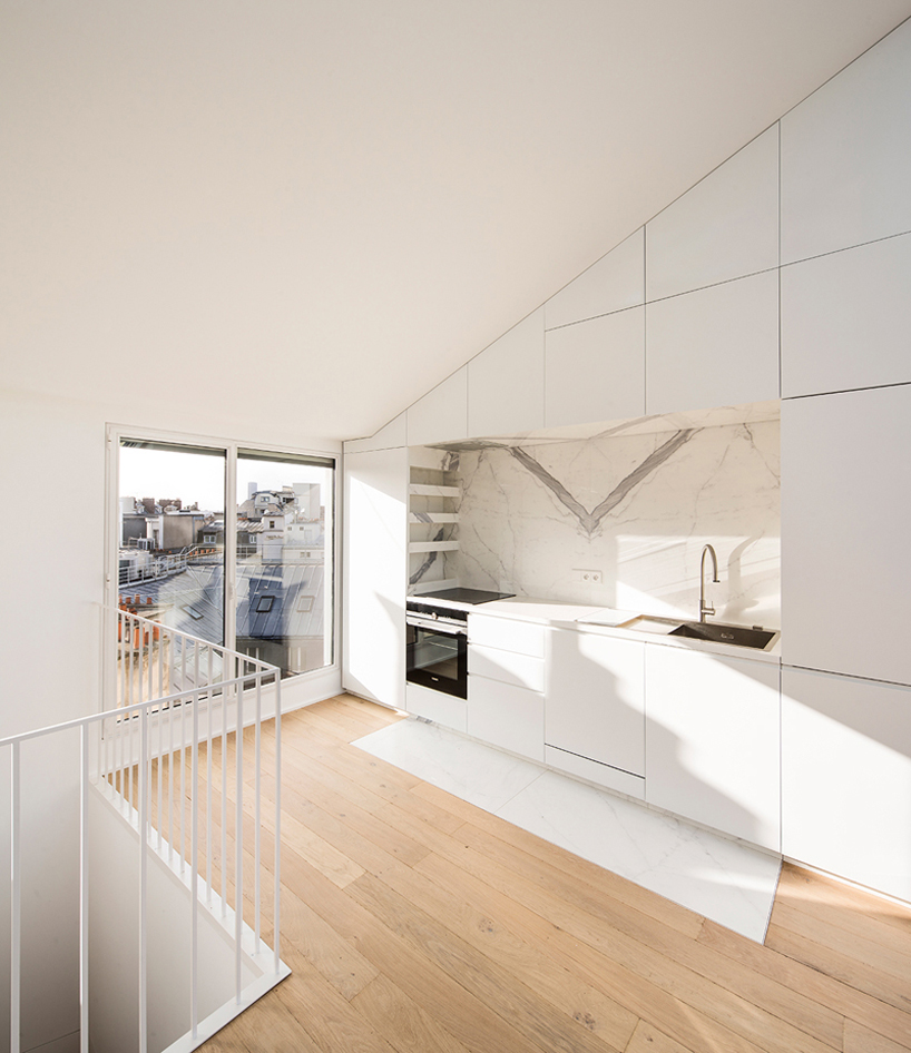 vincent parreira converts 19th century photography studio into parisian apartments