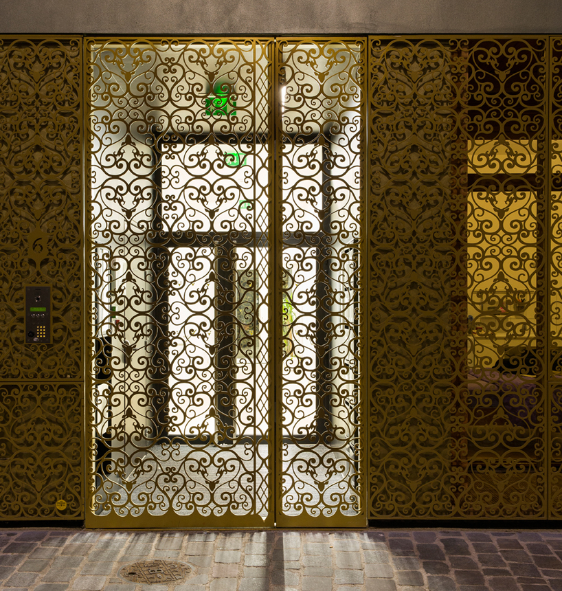 AAVP covers parisian building in golden sheets, carved like iron-worked balconies