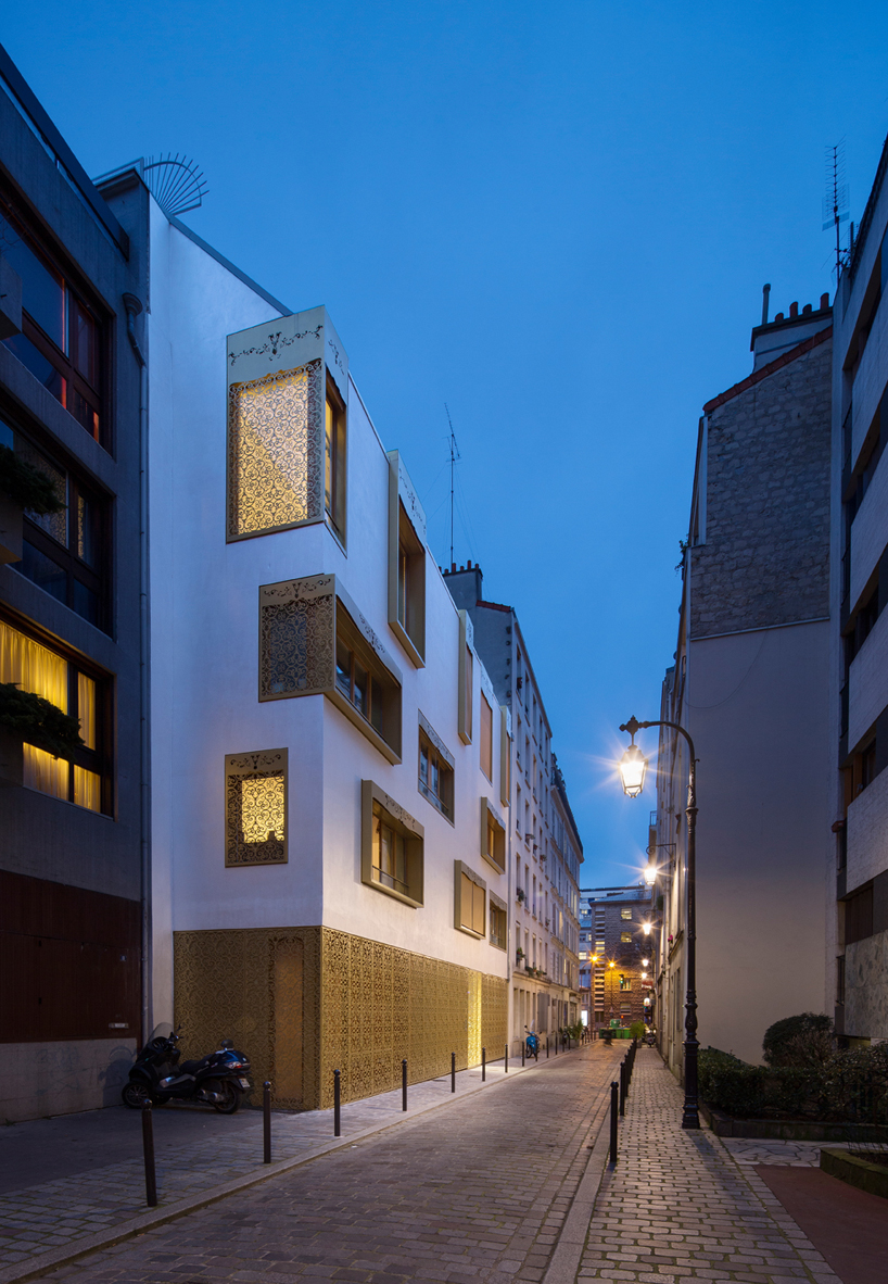 AAVP covers parisian building in golden sheets, carved like iron-worked balconies