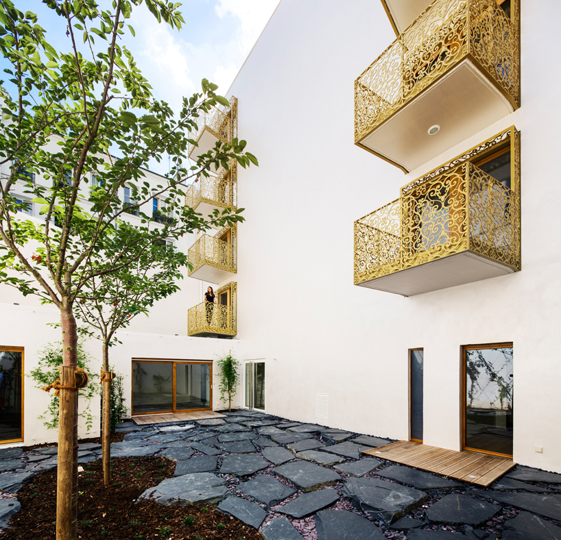AAVP covers parisian building in golden sheets, carved like iron-worked balconies
