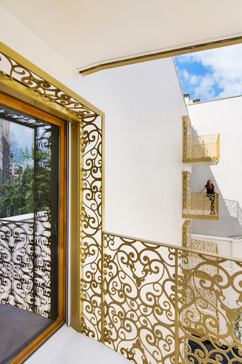AAVP covers parisian building in golden sheets, carved like iron-worked balconies