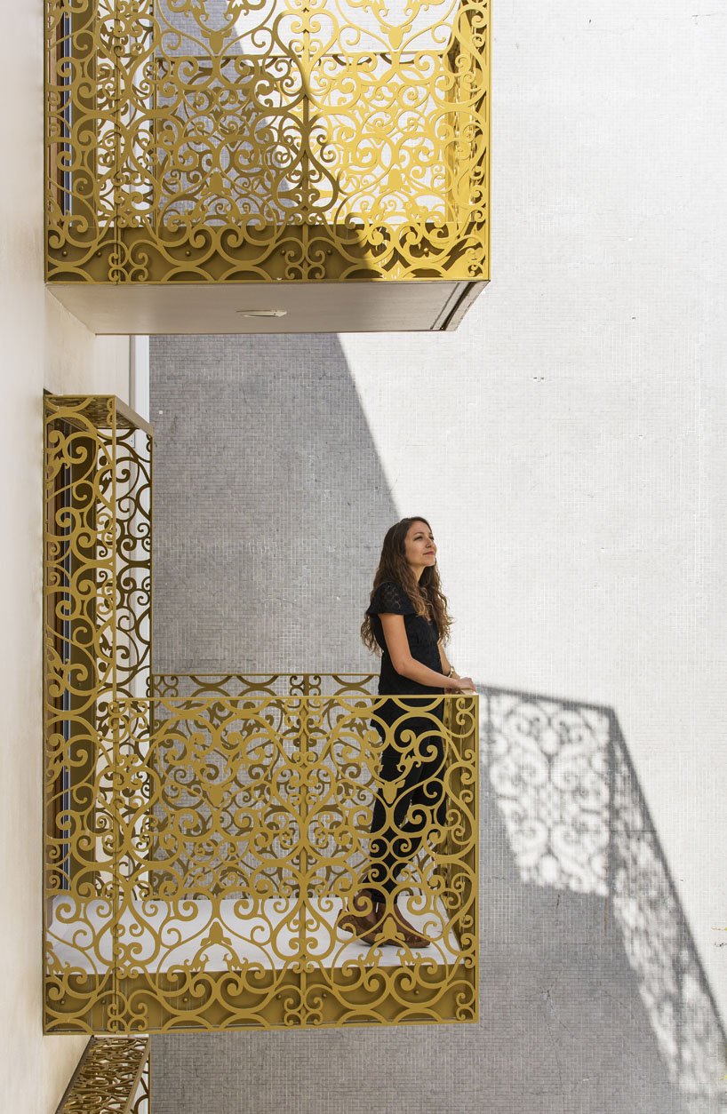 AAVP covers parisian building in golden sheets, carved like iron-worked balconies