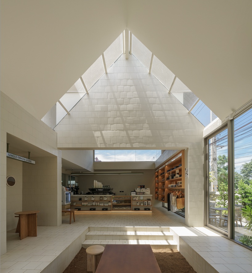 coffee beans cover sunken seating area in single origin chiangmai roastery by flat12x