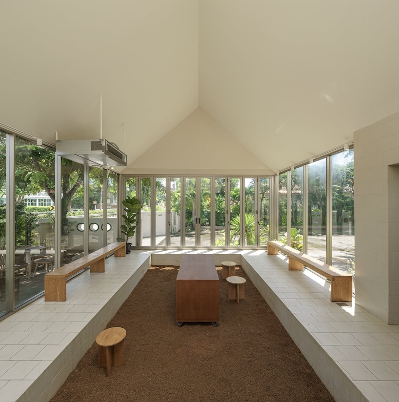 coffee beans cover sunken seating area in single origin chiangmai roastery by flat12x