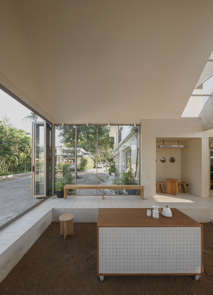 coffee beans cover sunken seating area in single origin chiangmai roastery by flat12x