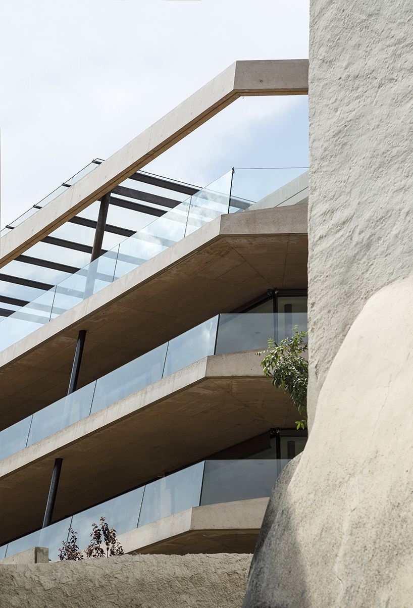 marx ladurner forms two concrete masses for residential complex in italy