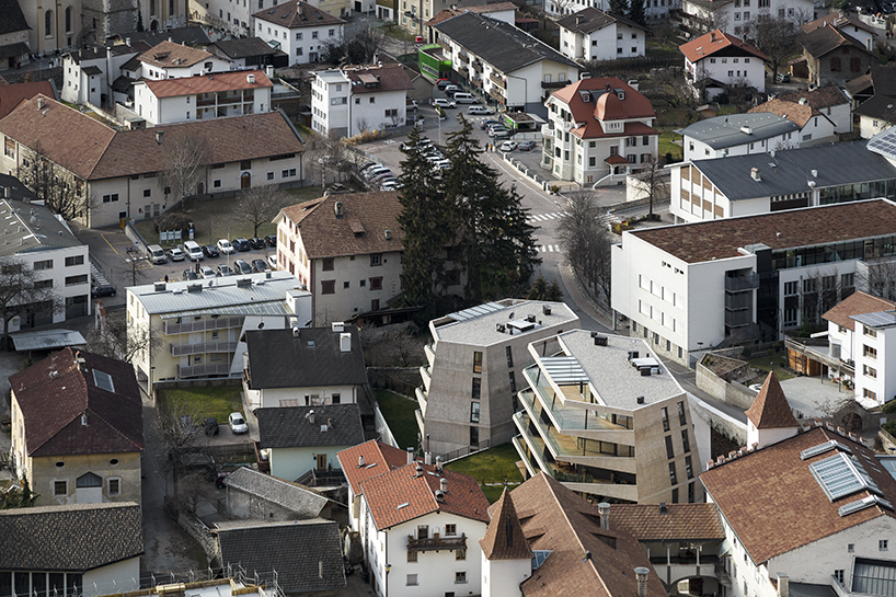 marx ladurner forms two concrete masses for residential complex in italy