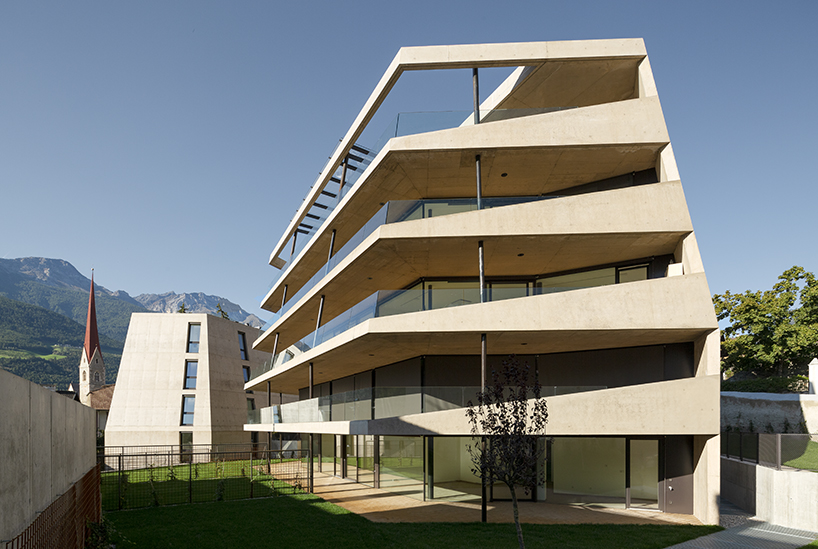 marx ladurner forms two concrete masses for residential complex in italy