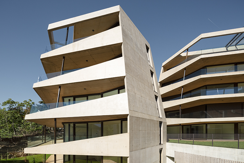 marx ladurner forms two concrete masses for residential complex in italy