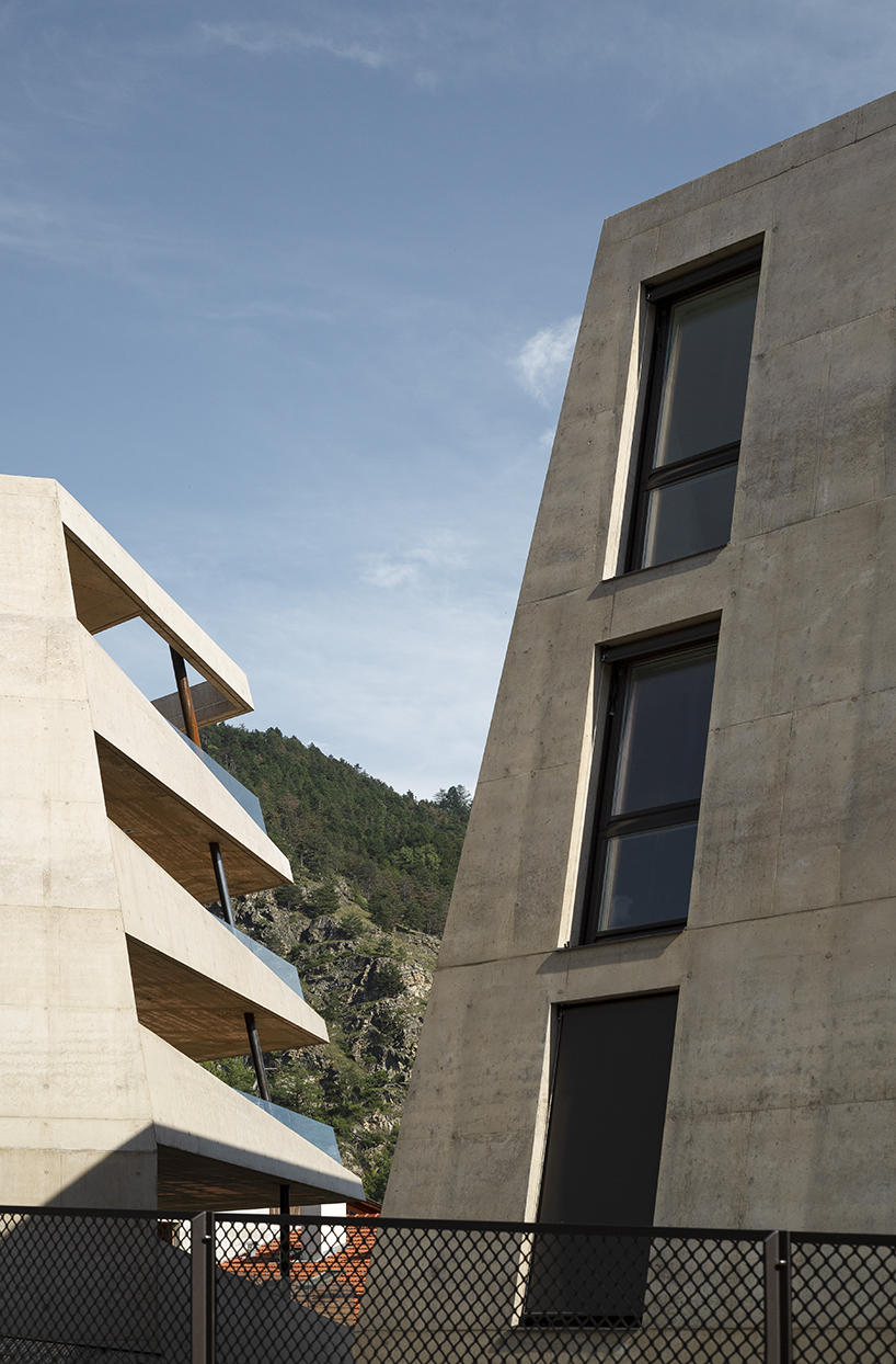 marx ladurner forms two concrete masses for residential complex in italy