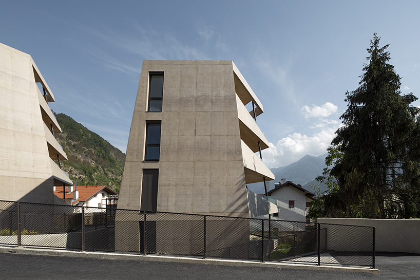 marx ladurner forms two concrete masses for residential complex in italy