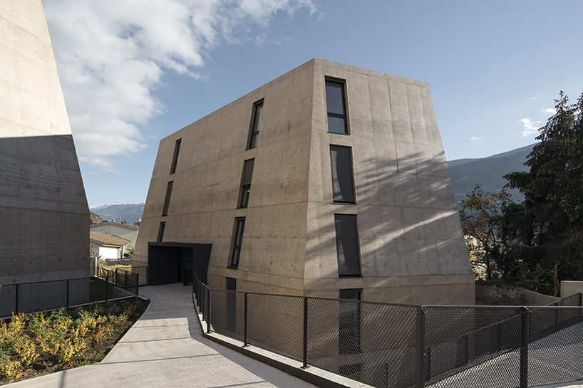 marx ladurner forms two concrete masses for residential complex in italy