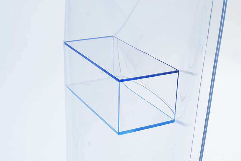 acrylic boxes and vinyl bags are combined into unusual freestanding structures