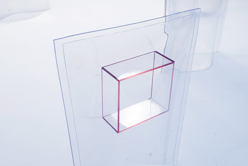 acrylic boxes and vinyl bags are combined into unusual freestanding structures
