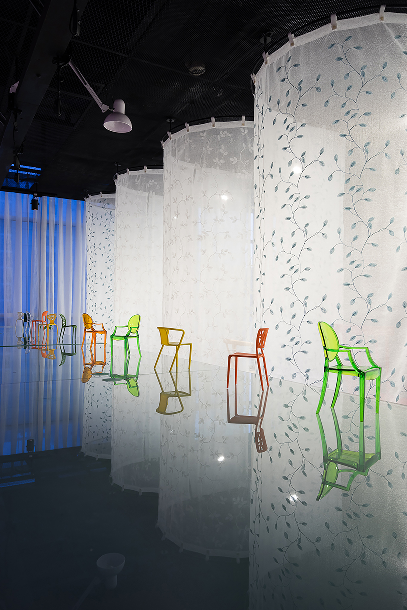 atelier tho.A drapes gamma’s office space with translucent ‘fabric walls’