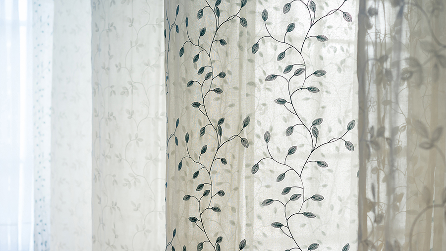 atelier tho.A drapes gamma’s office space with translucent ‘fabric walls’