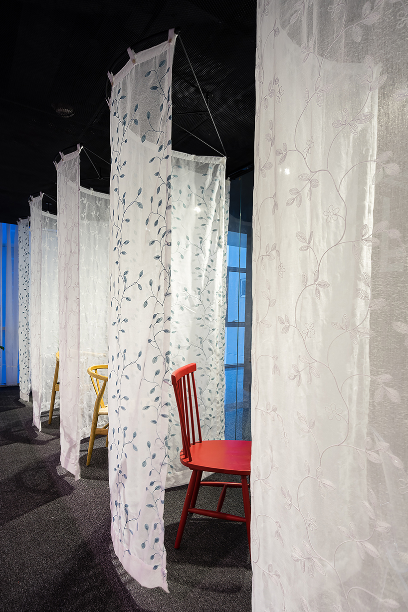 atelier tho.A drapes gamma’s office space with translucent ‘fabric walls’