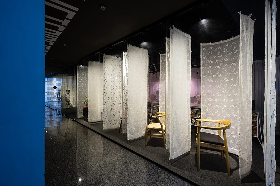 atelier tho.A drapes gamma’s office space with translucent ‘fabric walls’