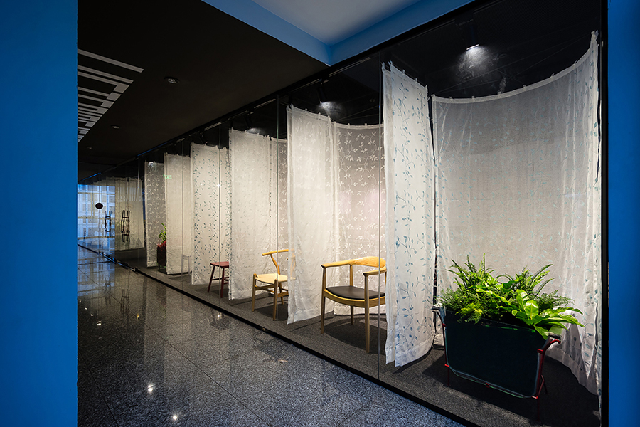 atelier tho.A drapes gamma’s office space with translucent ‘fabric walls’