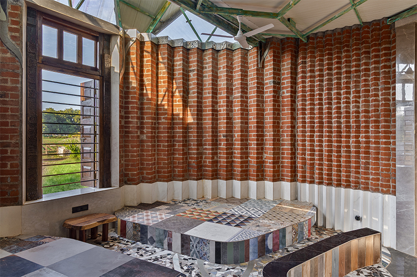 curved brick patterned walls frame farmhouse by manoj patel in india