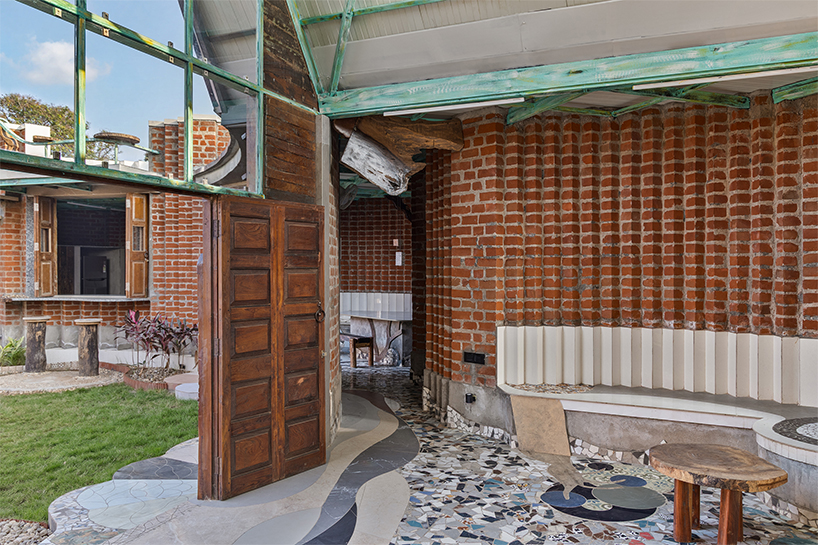 curved brick patterned walls frame farmhouse by manoj patel in india