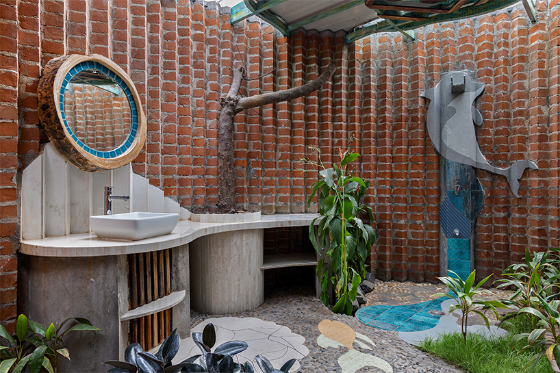 curved brick patterned walls frame farmhouse by manoj patel in india